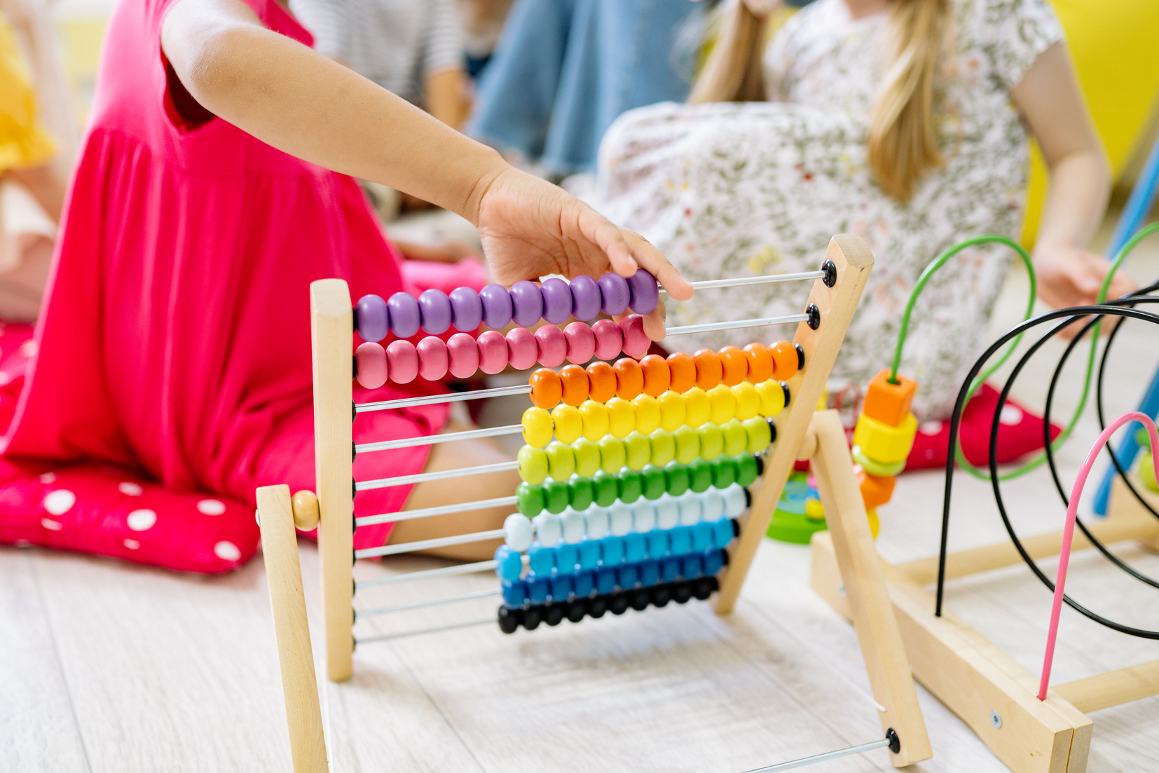 Person Holding Multi Colored Wooden Game Board