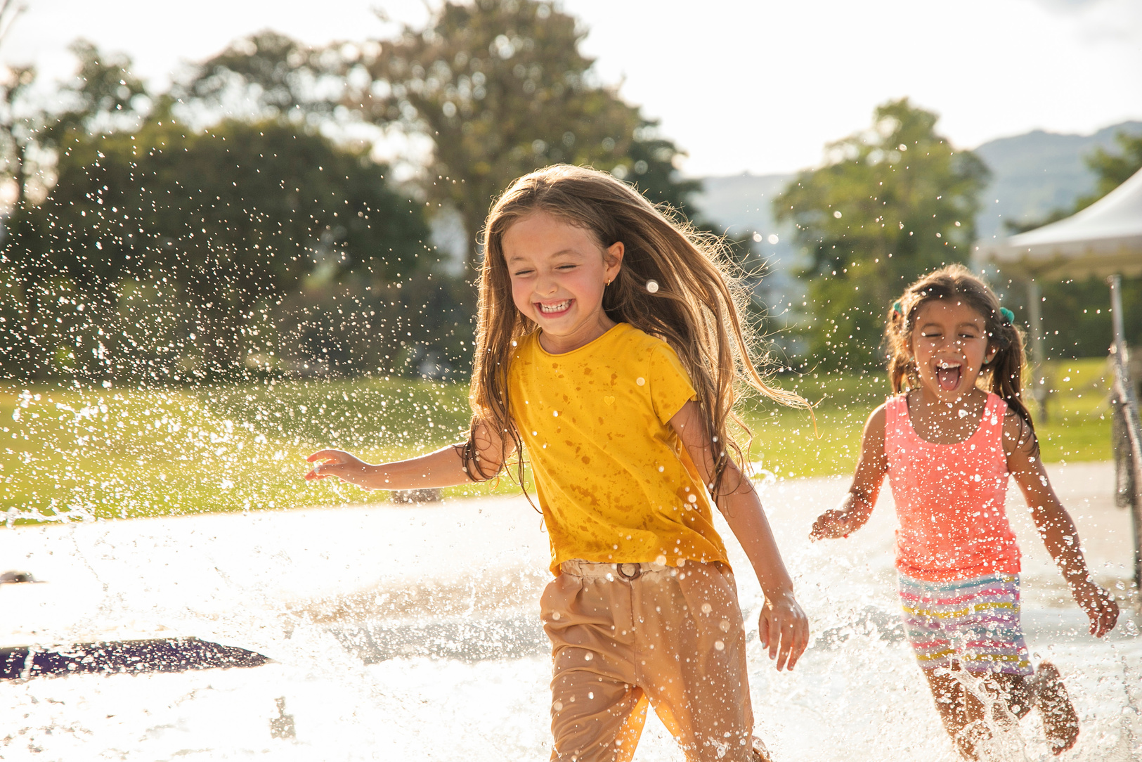 Kids Playing in the Water Outdoors