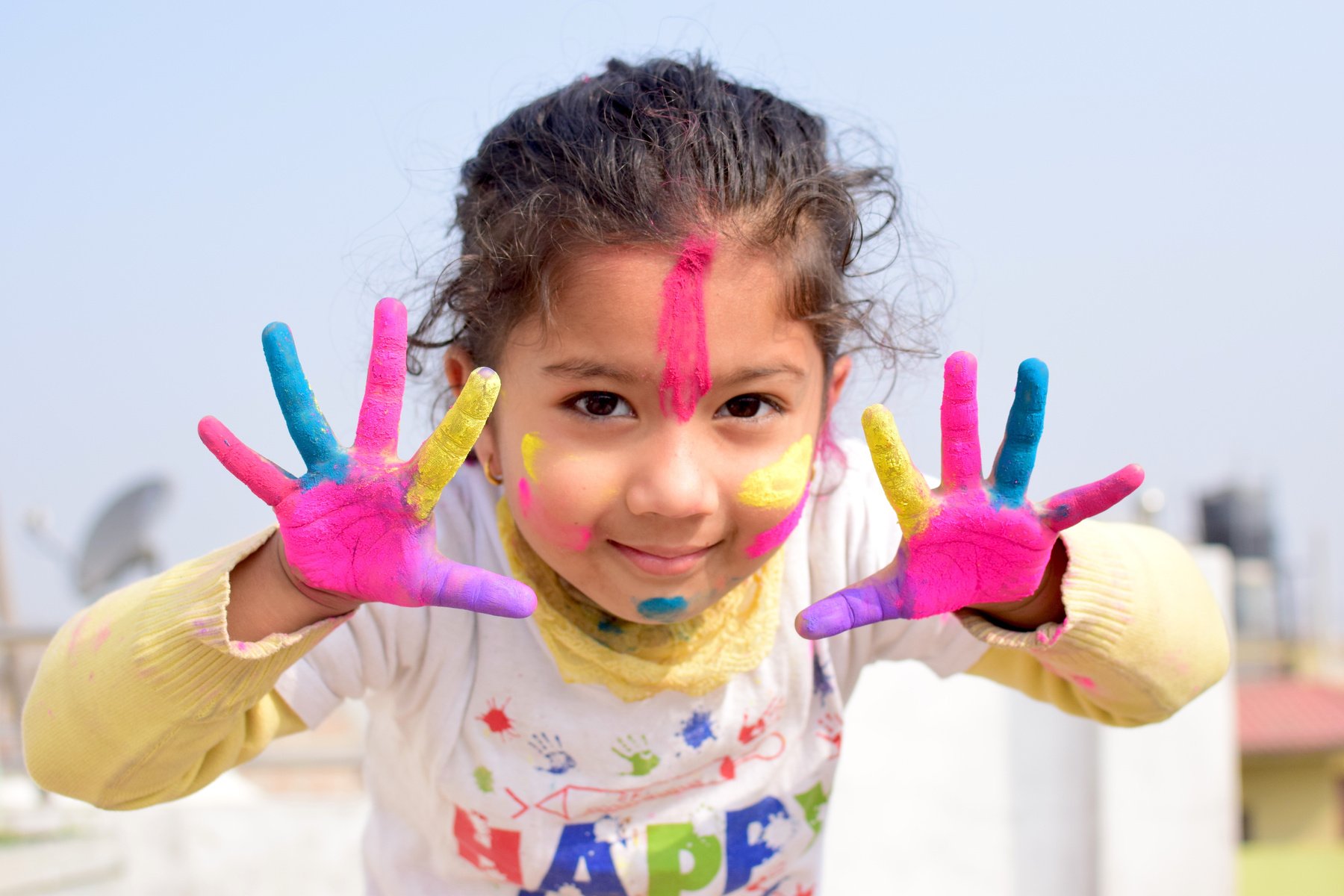 Girl in White and Pink Floral Shirt With Pink Hand Gloves